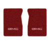 1981-1986 GMC K3500 front floor mats with the GMC logo in Cutpile 7039 Dark Red / Carmine carpet, illustration